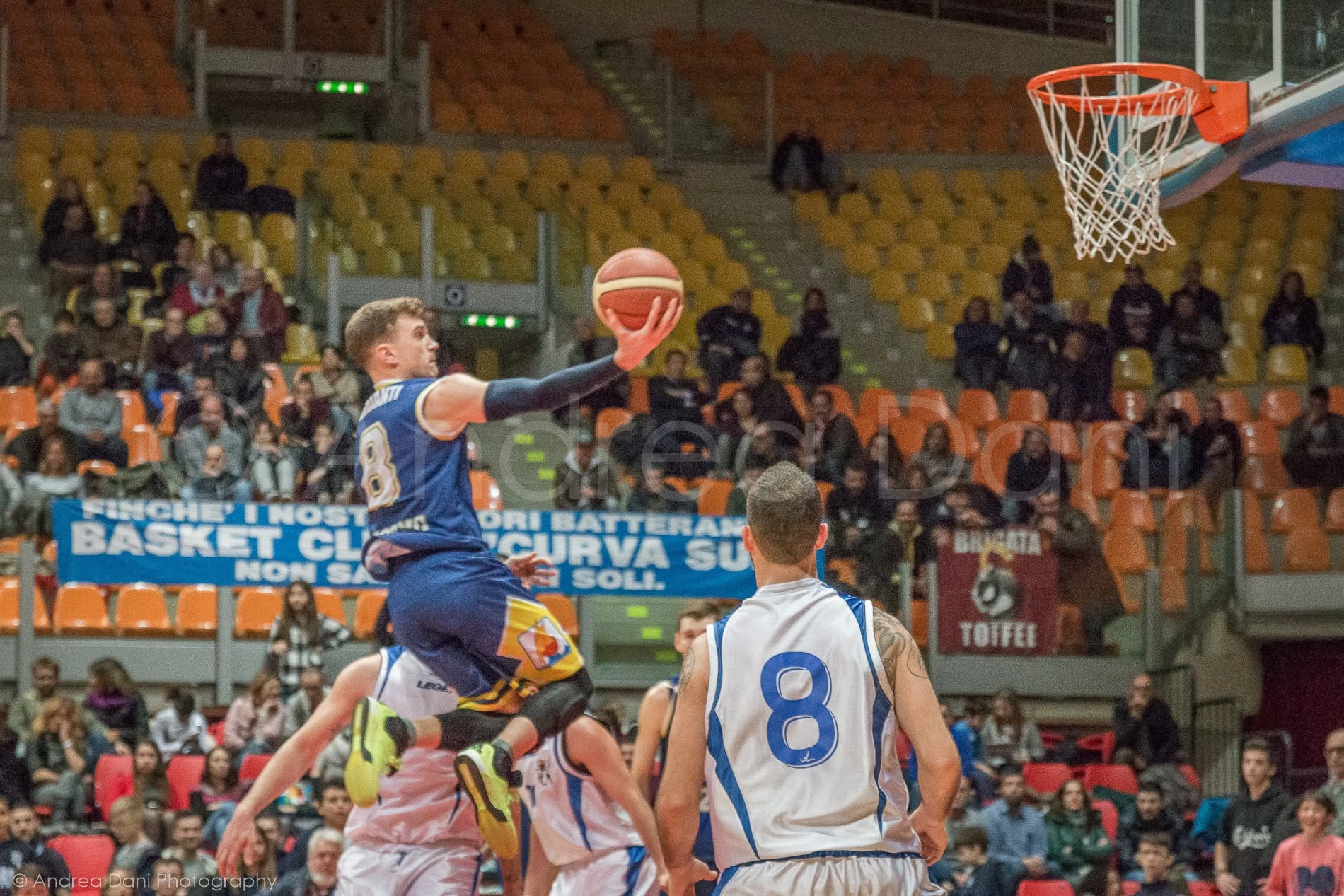 Alessandro Picchianti going up for a layup during a basketball game